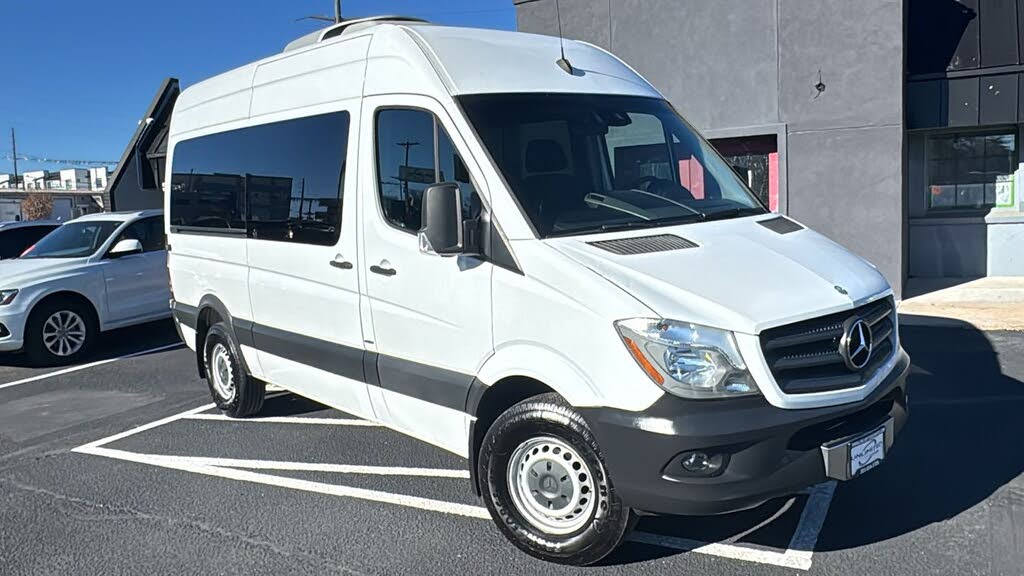 White Mercedes Sprinter passenger van